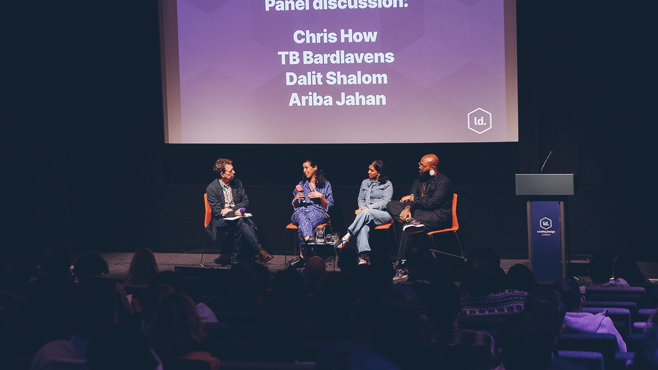 Chris How hosting panel discussion at Leading Design conference at the Barbican in London
