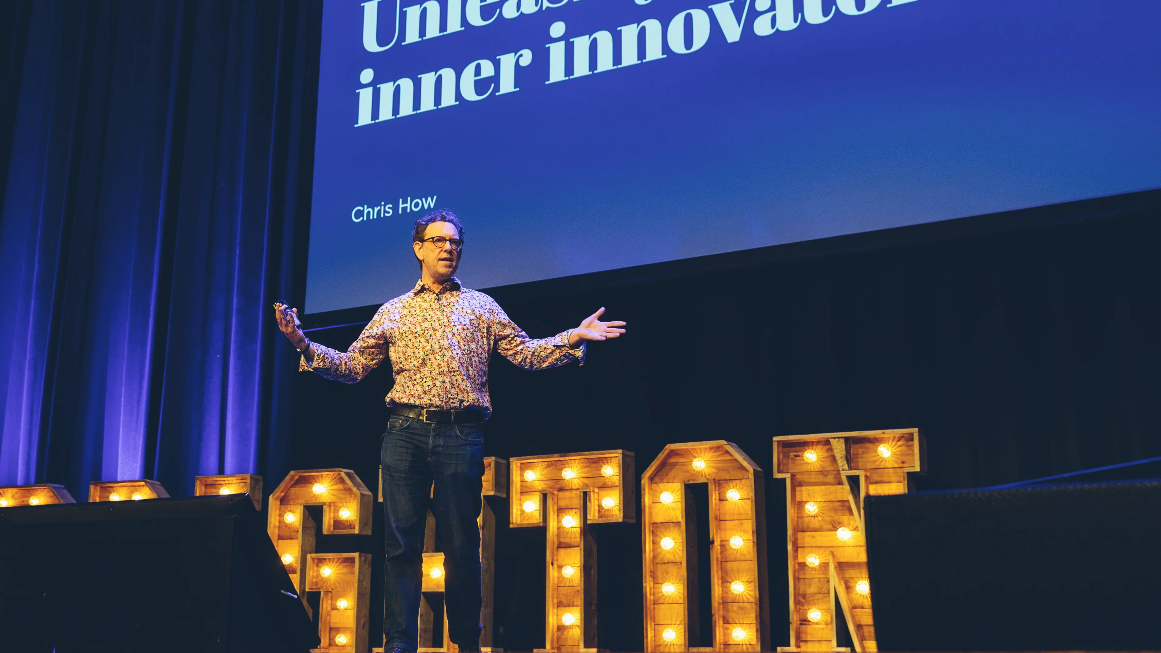 Chris How speaking at UX Brighton in the Dome Theatre